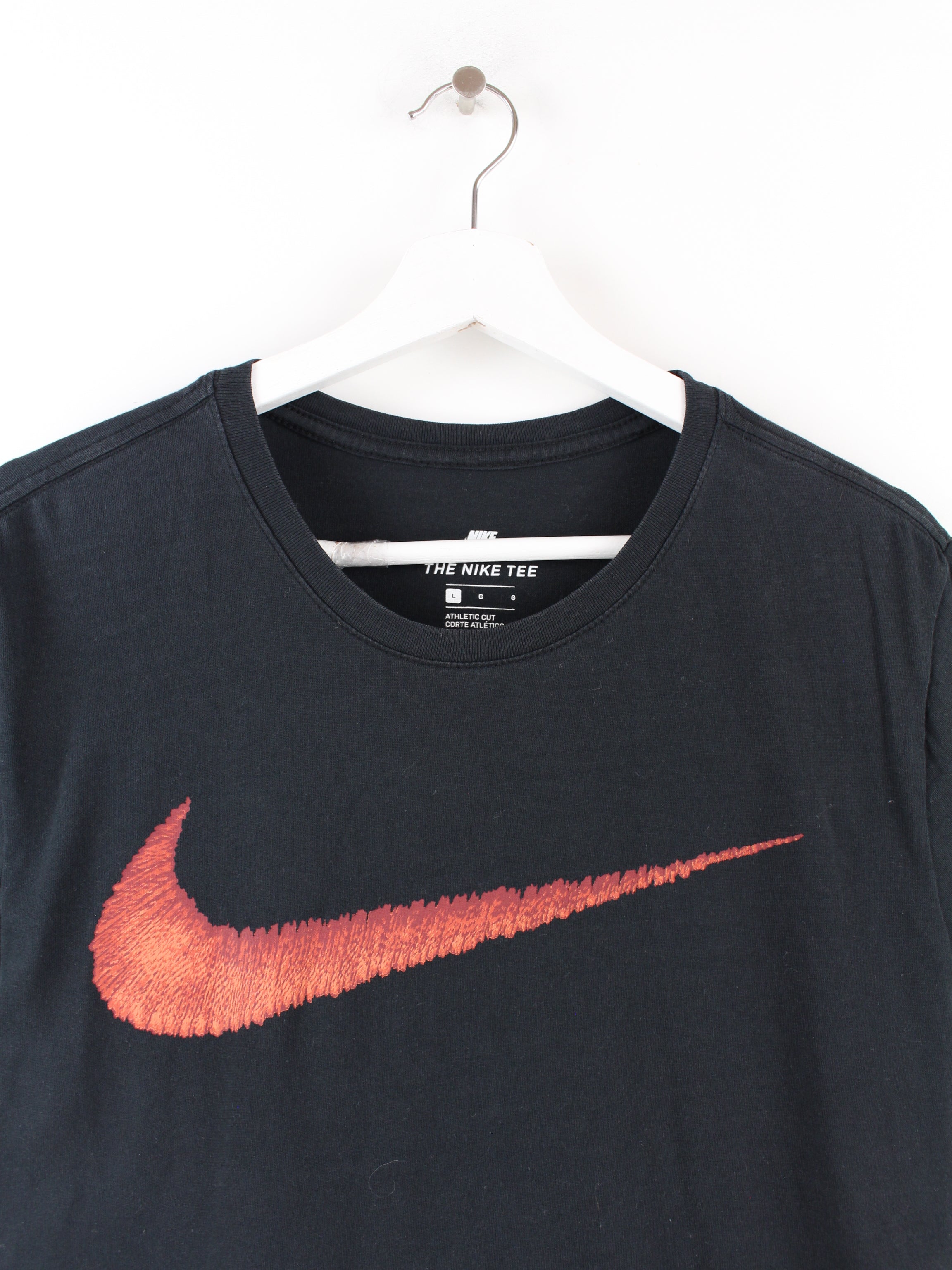 Black nike shirt shop with red swoosh