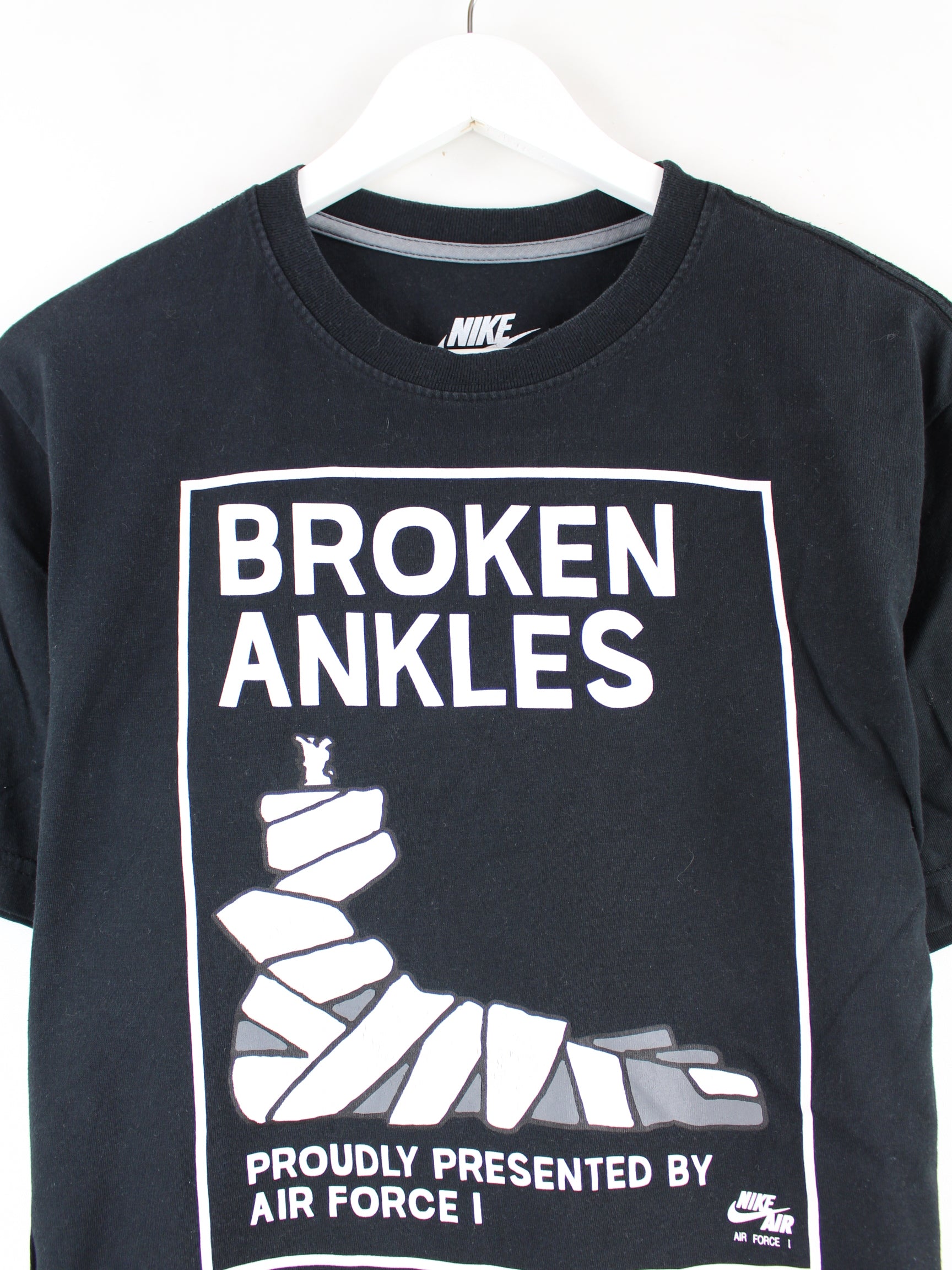 broken nike tee